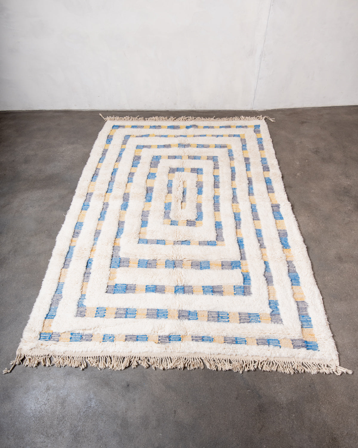 Modern, designer, handcrafted Berber rug from Morocco. Beniourain carpet with beautiful colours and patterns and fluffy wool texture.